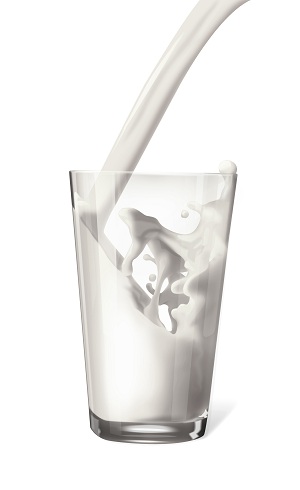 glass of milk being poured