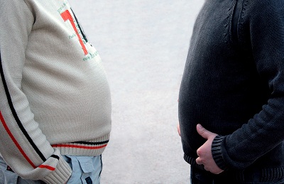 belly fat two guys with big bellies