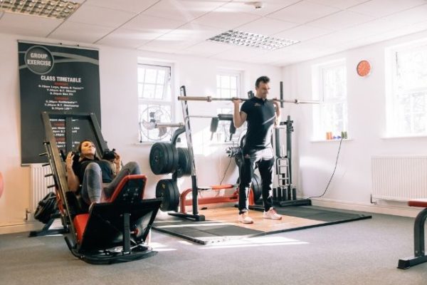 woman and man training legs at local Ribble Valley gym
