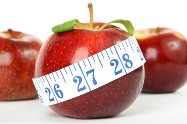 a fat apple with a tape measure around