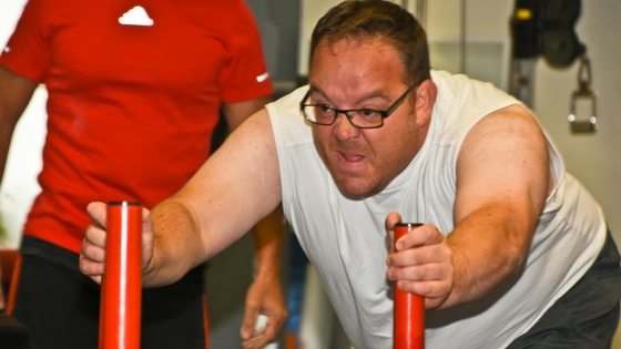 fat man doing fitness classes at the gym